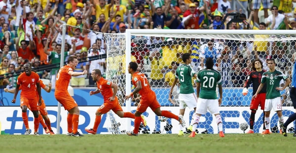 Sneijder of the Netherlands scores a goal against Mexico during their 2014 World Cup round of 16 game at the Castelao arena in Fortaleza Netherlands vs Mexico