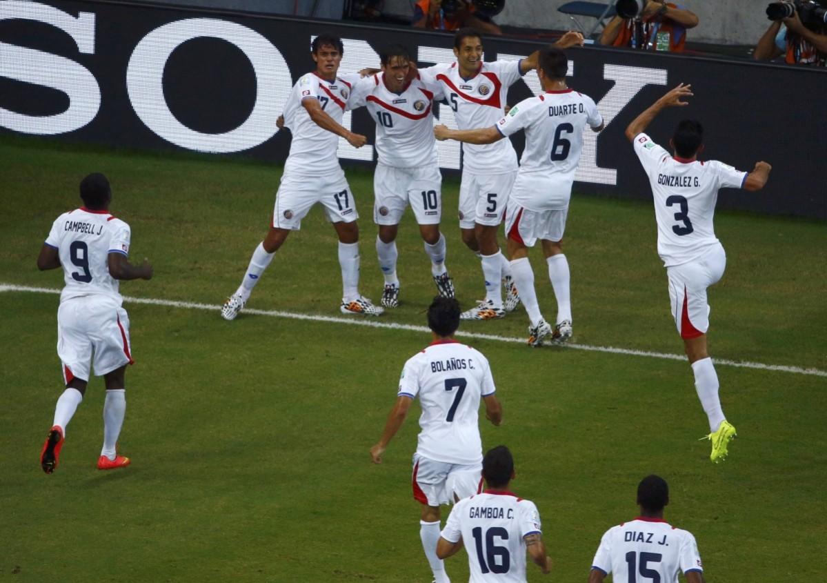 Costa Rica's Bryan Ruiz celebrates with teammates after scoring a goal during the 2014 World Cup round of 16 game between Costa Rica and Greece at the Pernambuco arena Costa Rica vs Greece