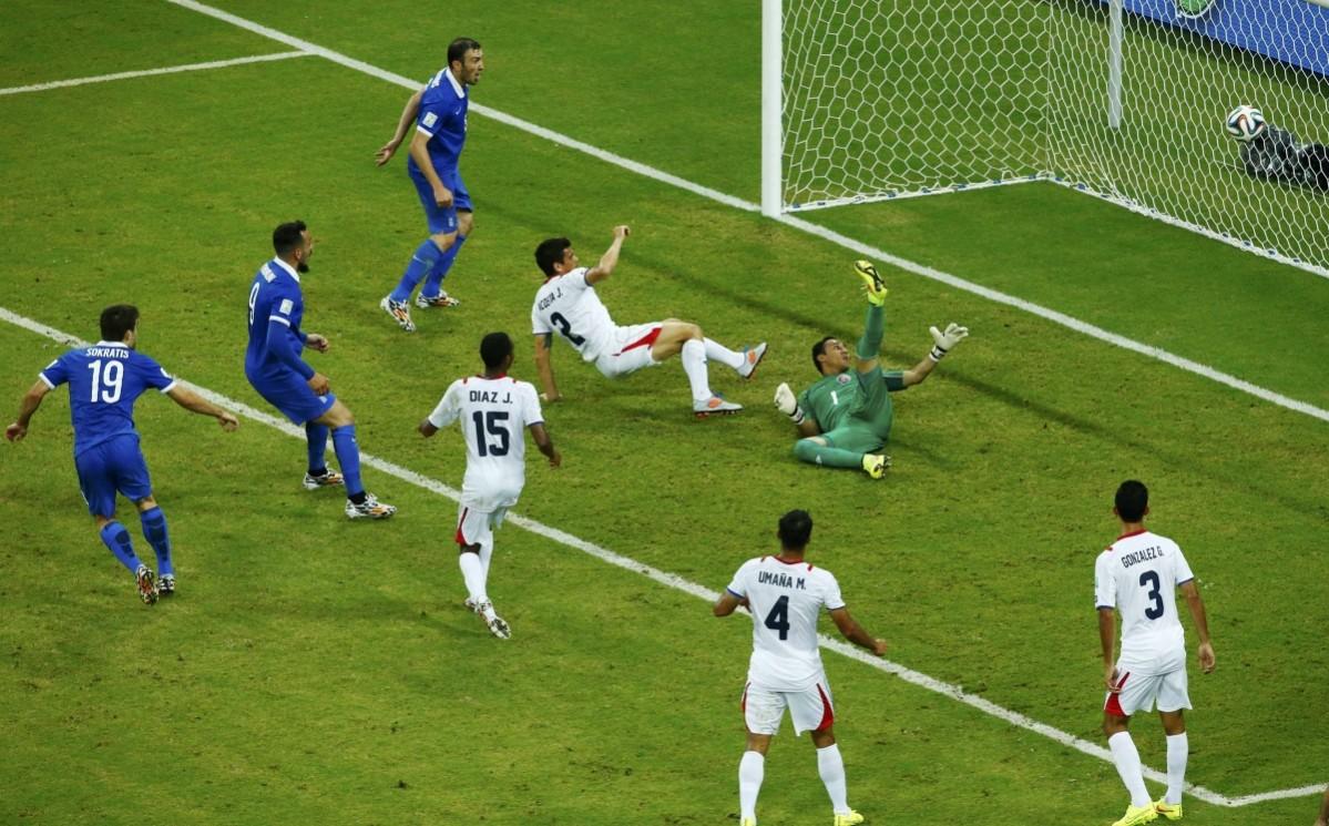 Greece's Papastathopoulos shoots to score against Costa Rica during their 2014 World Cup round of 16 game at the Pernambuco arena in Recife Costa Rica vs Greece