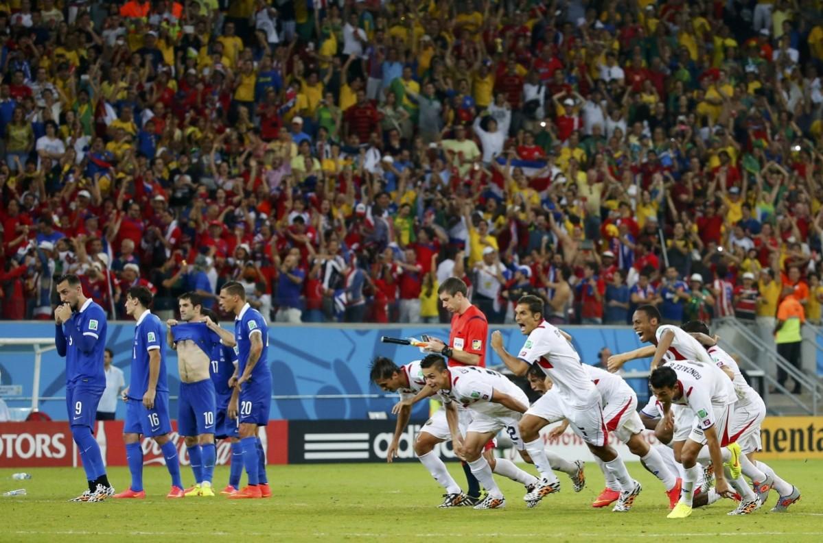 Costa Rica's players celebrate after the deciding goal during a penalty shootout in their 2014 World Cup round of 16 game against Greece at the Pernambuco arena in Recife Costa Rica vs Greece