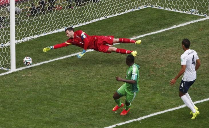 Nigeria's Emenike kicks to score a goal against France's goalkeeper Lloris, which was later ruled offside, during their 2014 World Cup round of 16 game at the Brasilia national stadium in Brasilia France vs Nigeria