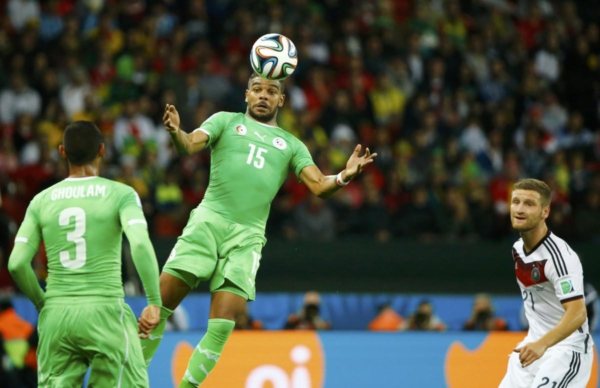 Algeria's Soudani controls the ball next to Ghoulam and Germany's Mustafi during their 2014 World Cup round of 16 game at the Beira Rio stadium in Porto Alegre Germany vs Algeria