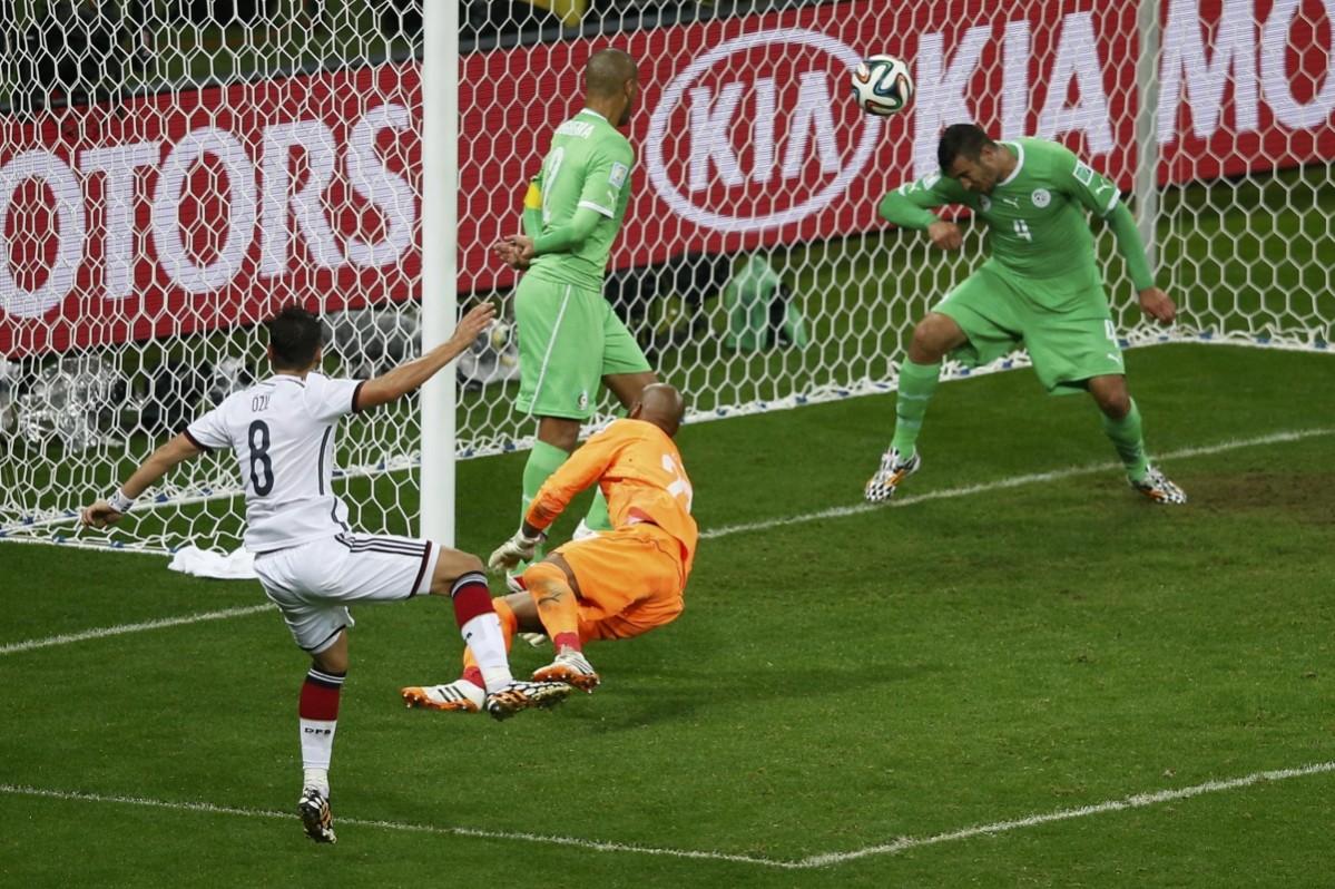 Germany's Ozil scores against Algeria during their 2014 World Cup round of 16 game at the Beira Rio stadium in Porto Alegre Germany vs Algeria