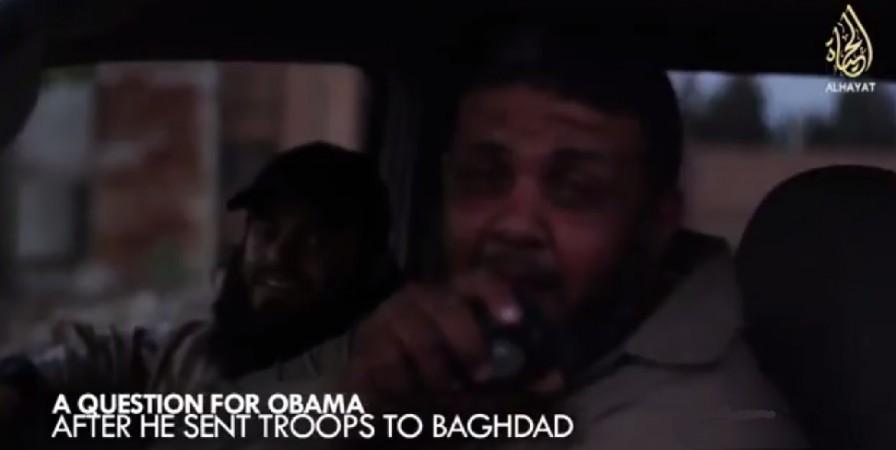 A jihadist mocks Obama,while Abu Safiyya wearing baseball cap is seen smiling.