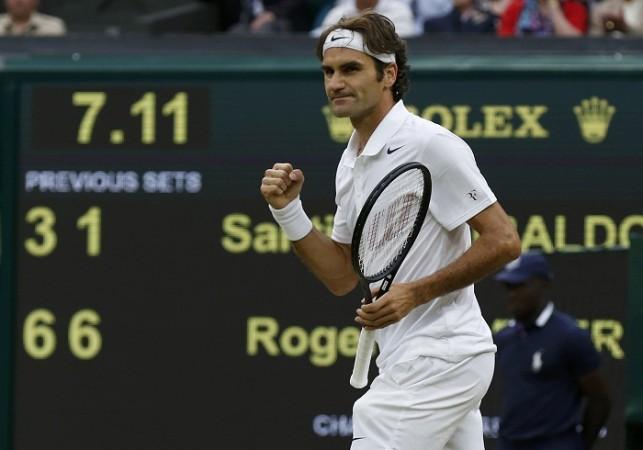 Roger Federer of Switzerland reacts after defeating Santiago Giraldo of Colombia. Roger Federer