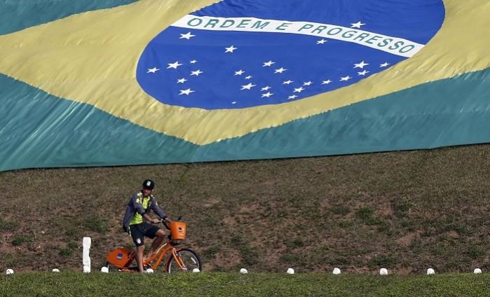 Brazil forward Neymar continues to carry the hopes of an entire nation Neymar Brazil flag