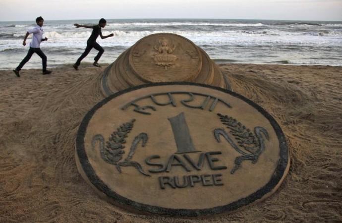 Sand Sculpture of One Rupee Coin