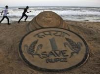 Sand Sculpture of One Rupee Coin