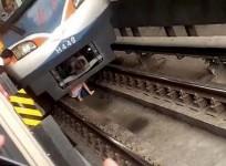 Pregnant Chinese woman falls under train track,escapes unhurt