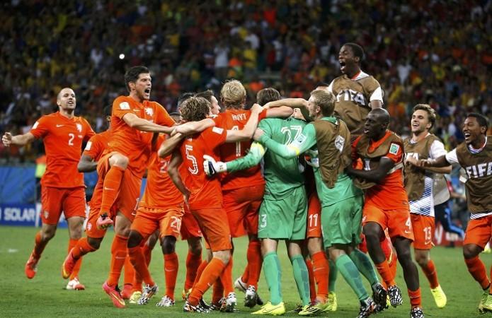 Netherlands players celebrate with Tim Krul after a dramatic penalty shootout victory over Costa Rica in the FIFA World Cup 2014 quarterfinals Netherlands