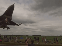 Spectators enjoying an air-show in Lincolnshire, were forced to dive for cover as a F-16 fighter jet zipped through only about a meter away from their heads.