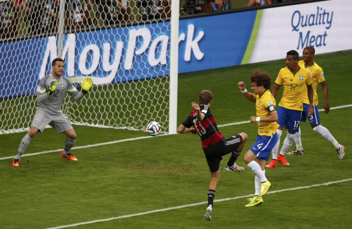 Germany's Thomas Mueller scores a goal against Brazil during their 2014 World Cup semi-finals at the Mineirao stadium in Belo Horizonte Brazil vs Germany