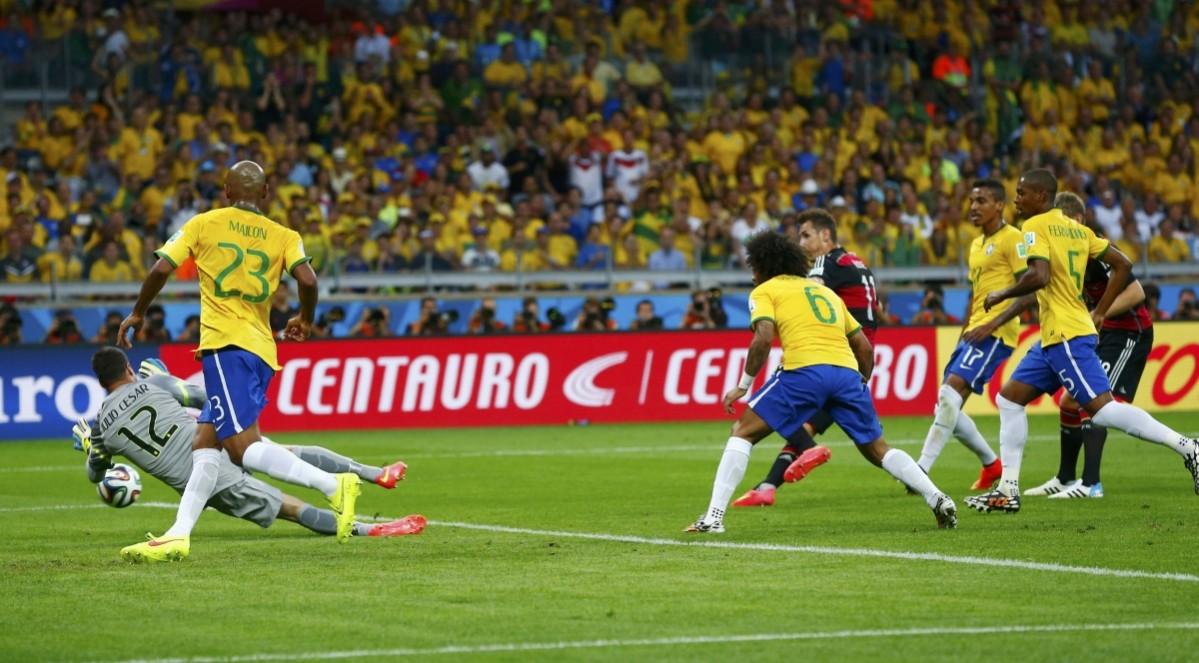Germany's Klose shoots to score his team's second goal against Brazil during their 2014 World Cup semi-finals at the Mineirao stadium in Belo Horizonte Brazil vs Germany
