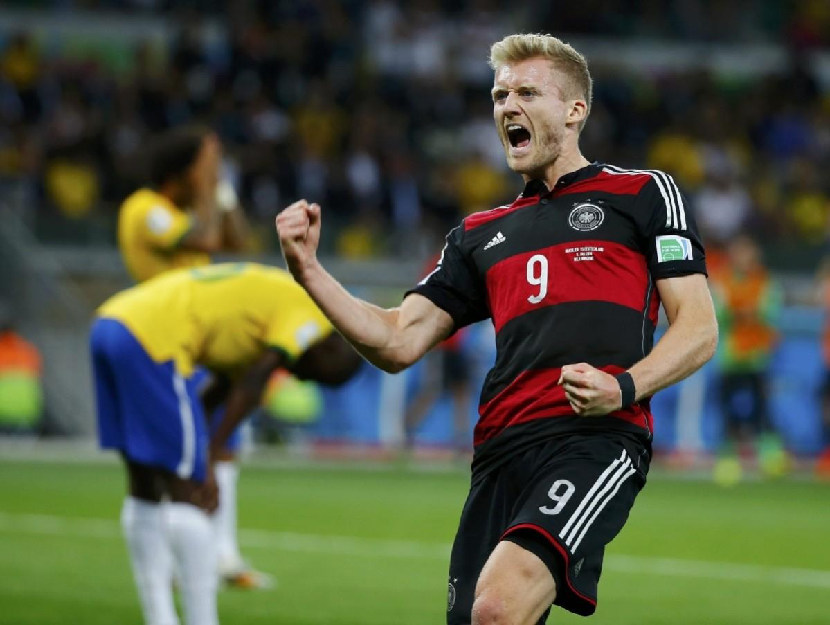 Germany's Schuerrle celebrates scoring his team's sixth goal against Brazil during their 2014 World Cup semi-finals at the Mineirao stadium in Belo Horizonte Brazil vs Germany