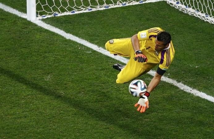 Argentina's goalkeeper Sergio Romero saves shot from Ron Vlaar of the Netherlands. Sergio Romero