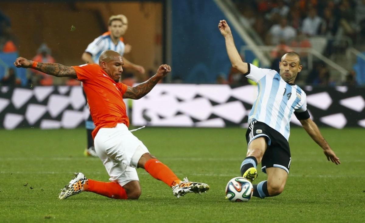 Clasie of the Netherlands fights for the ball with Argentina's Mascherano during their 2014 World Cup semi-finals at the Corinthians arena in Sao Paulo Netherlands vs Argentina