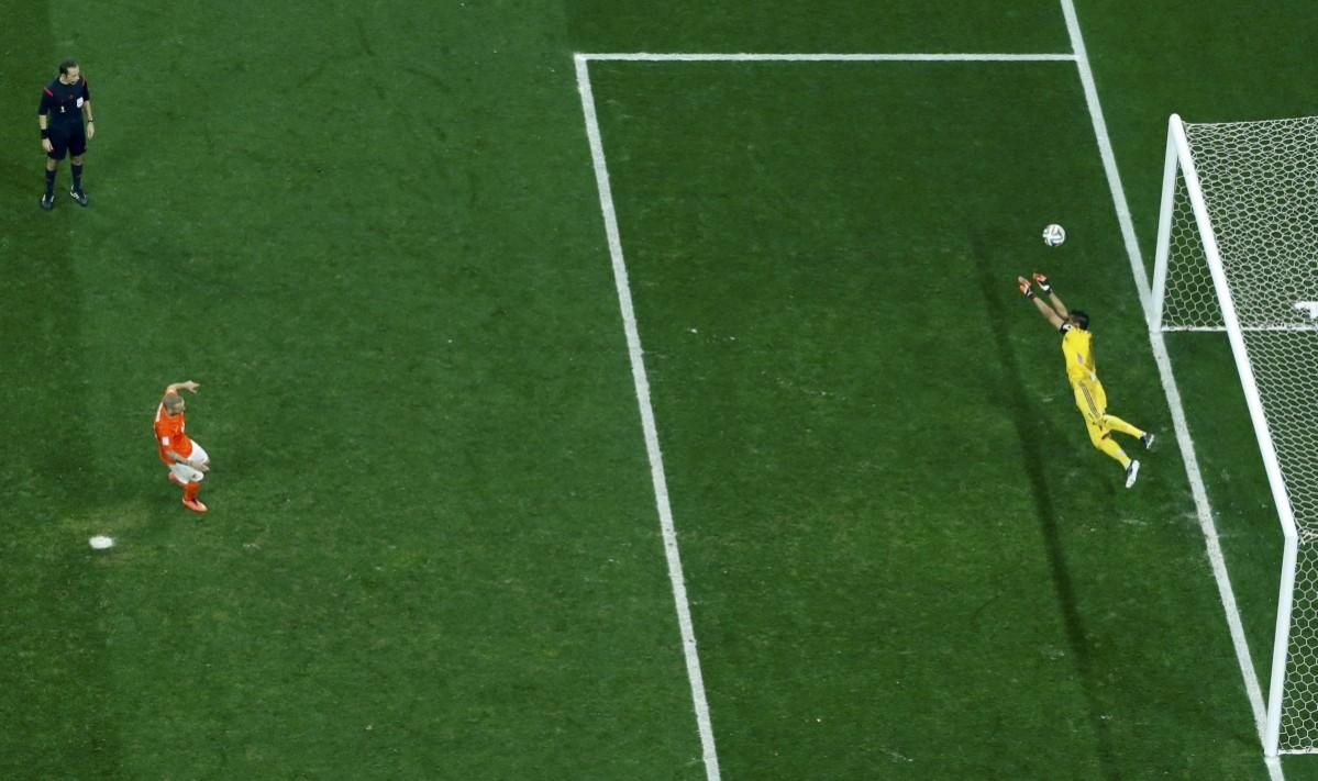 Argentina's goalkeeper Sergio Romero saves a penalty shot from Wesley Sneijder of the Netherlands during a penalty shootout in the 2014 World Cup semi-finals between Argentina and the Netherlands at the Corinthians arena Netherlands vs Argentina