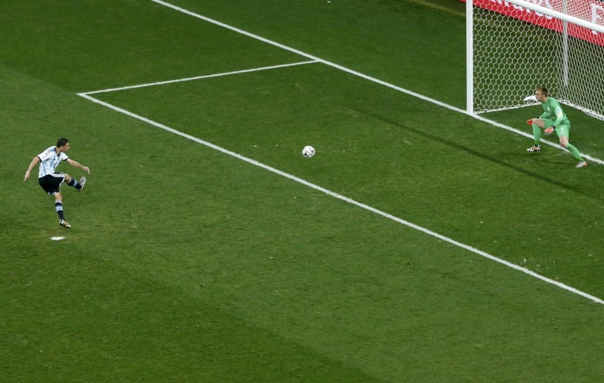 Argentina's Maxi Rodriguez scores a goal to win their penalty shootout against the Netherlands in their 2014 World Cup semi-finals at the Corinthians arena in Sao Paulo Netherlands vs Argentina