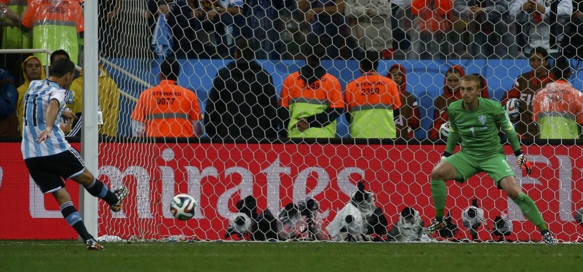 Argentina's Rodriguez shoots the match deciding penalty in their 2014 World Cup semi-finals against Netherlands at the Corinthians arena in Sao Paulo Netherlands vs Argentina