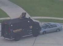 Still image taken from KPRC-TV aerial video footage of police and suspect's vehicles in a standoff at a residential neighborhood following a shooting incident in Spring, Texas