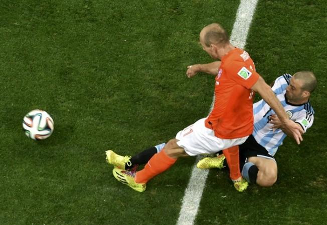Argentina's Javier Mascherano blocks a shot by Arjen Robben of the Netherlands. Javier Mascherano and Arjen Robben