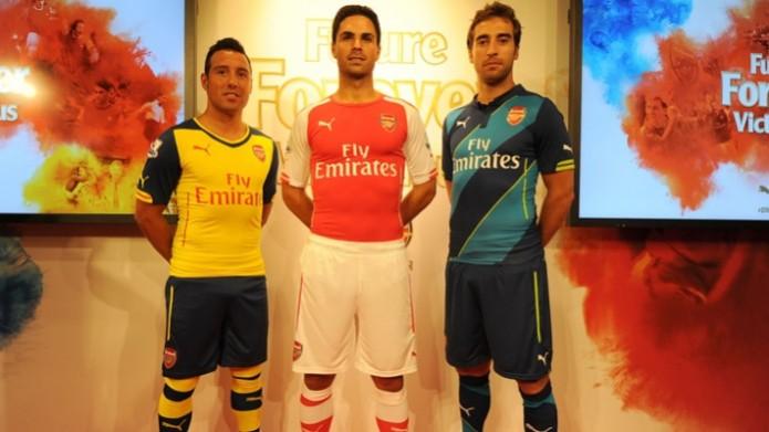 Santi Cazorla, Mikel Arteta and Mathieu Flamini model Arsenal's new away, home and third kits for the 2014/15 season Arsenal kit Lauching ceremony