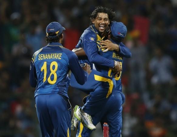Sri Lanka's Tillakaratne Dilshan celebrates with captain Angelo Mathews and Sachithra Senanayake. Tillakaratne Dilshan