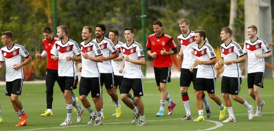 Germany's national soccer team players run during a training session in the village of Santo Andre Germany
