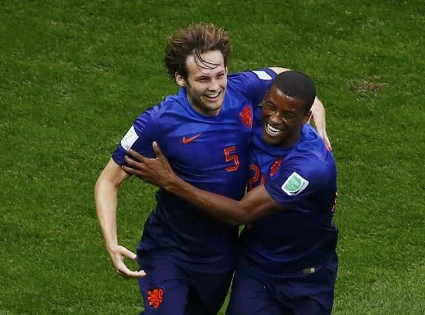 Netherlands defender Daley Blind celebrates with teammate Georginio Wijnaldum after scoring against Brazil in their third-place playoff Daley Blind Georginio Wijnaldum Netherlands