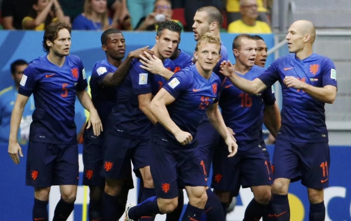 Robin van Persie of the Netherlands celebrates his goal against Brazil with his teammates during their 2014 World Cup third-place playoff at the Brasilia national stadium in Brasilia Brazil vs Netherlands
