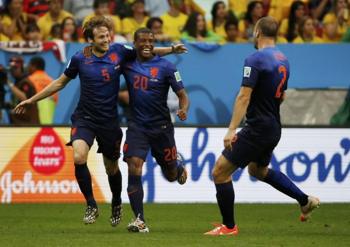 Blind of the Netherlands celebrates with Wijnaldum and Vlaar after scoring against Brazil during their 2014 World Cup third-place playoff at the Brasilia national stadium in Brasilia Brazil vs Netherlands