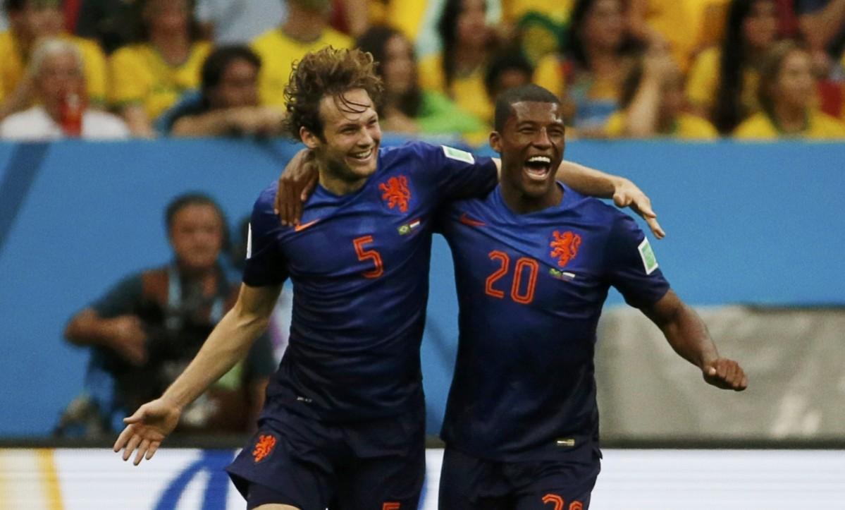 Blind of the Netherlands celebrates with Wijnaldum after scoring against Brazil during their 2014 World Cup third-place playoff at the Brasilia national stadium in Brasilia Brazil vs Netherlands