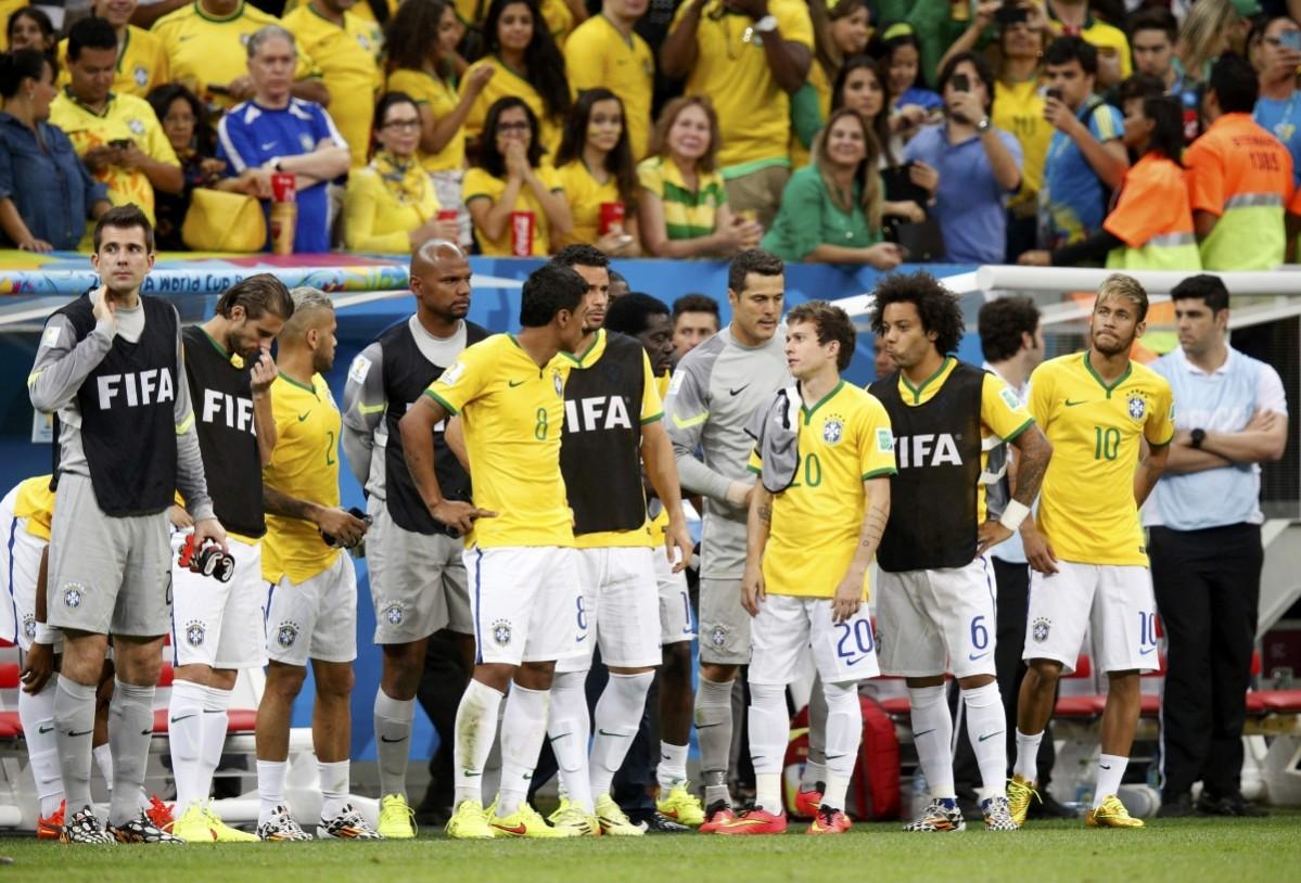 Brazil's Neymar (R) and teammates react after the 2014 World Cup third-place playoff between Brazil and the Netherlands at the Brasilia national stadium Brazil vs Netherlands