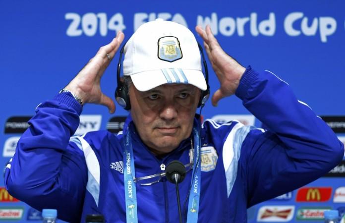 Argentina's coach Alejandro Sabella adjusts his headphones during a news conference at the Maracana stadium in Rio de Janeiro Alejandro Sabella