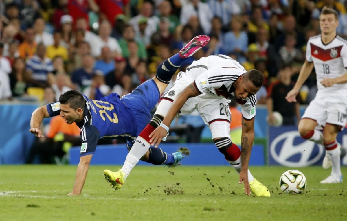 Argentina's Sergio Aguero falls as Germany's Jerome Boateng goes for the ball during 2014 World Cup final at the Maracana stadium in Rio de Janeiro. Germany vs Argentina