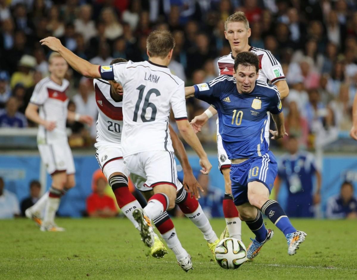 Argentina's Messi is challenged by Germany's Boateng and Lahm during 2014 World Cup final at the Maracana stadium in Rio de Janeiro. Germany vs Argentina