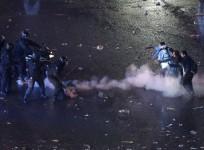 Argentina's fans clash with riot police after Argentina lost to Germany in 2014 World Cup final soccer match in Brazil, at public square viewing area in Buenos Aires