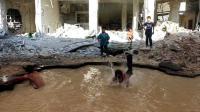 craters-from-barrel-bombs-turned-into-street-pools-in-aleppo