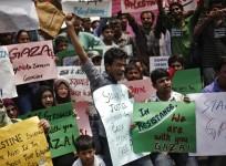 Demonstrators hold placards and shout slogans during a protest rally against the Israel's attacks on Gaza, outside the Israeli embassy in New Delhi