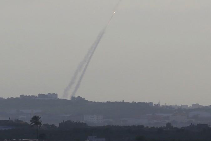 Smoke trails are seen as a rocket is launched from the northern Gaza Strip towards Israel. Smoke trails are seen as a rocket is launched from the northern Gaza Strip towards Israel