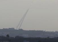 Smoke trails are seen as a rocket is launched from the northern Gaza Strip towards Israel