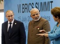 Brazil's President Rousseff talks to Russia's President Putin and India's Prime Minister Modi while they pose for a group picture during the VI BRICS Summit in Fortaleza