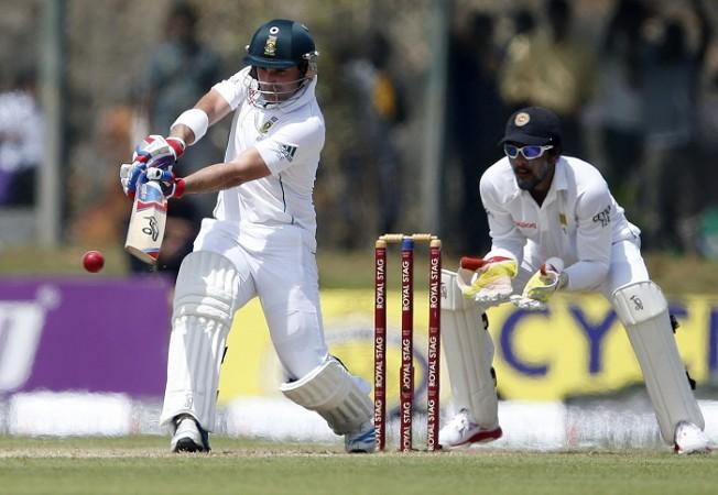 South Africa's Dean Elgar plays a shot next to Sri Lanka's wicketkeeper Dinesh Chandimal. Dean Elgar