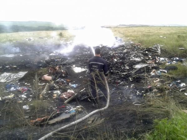 Man works at putting out a fire at the site of a Malaysia Airlines Boeing 777 plane crash in the settlement of Grabovo in the Donetsk region Malaysia Airlines Boeing 777