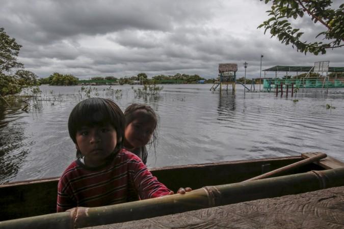 Children are seen in flooded Puerto Almacen, on the outskirts of Trinidad in the northeast region of Beni department, in Bolivia