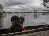 Children are seen in flooded Puerto Almacen, on the outskirts of Trinidad in the northeast region of Beni department, in Bolivia