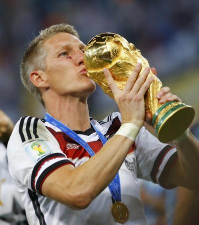 Bastian Schweinsteiger is reportedly a person of interest for Manchester United manager Louis Van Gaal Bastian Schweinsteiger Germany World Cup trophy