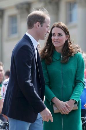 Prince William, the Duke of Cambridge and his wife, Catherine, the Duchess of Cambridge pose in front of the pack of riders at Harewood House in Leeds Kate Middleton