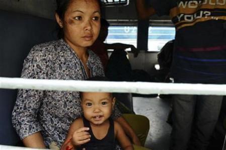 A representational picture: A woman with her child on a train at a Bangalore railway station in August 2012, when northeast people fled the city in fear of racial attacks. Attack on northeastern citizens