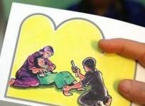 A counselor in Egypt holds up cards used to educate women about female genital mutilation (FGM) in Minia.